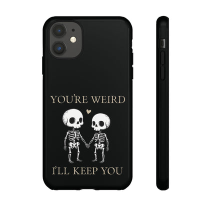 Glossy skeleton couple phone case with two skeletons holding hands, red heart, quirky “You’re Weird I’ll Keep You” design by SkeletonWear Apparel