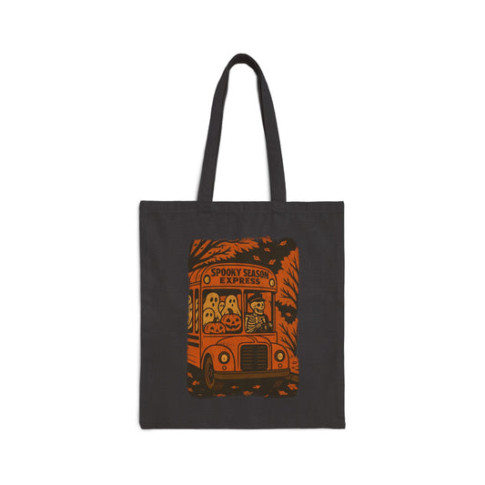 Vintage Halloween skeleton bus tote bag with spooky season express design, ghosts, pumpkins, and retro orange school bus illustration by SkeletonWear Apparel