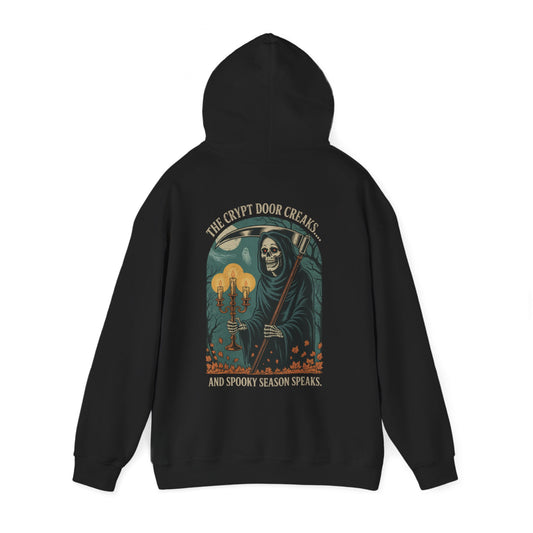 Vintage-style Grim Reaper Halloween hoodie with gothic woodcut artwork, glowing candles, eerie moonlit forest, and sinister skeleton reaper design.