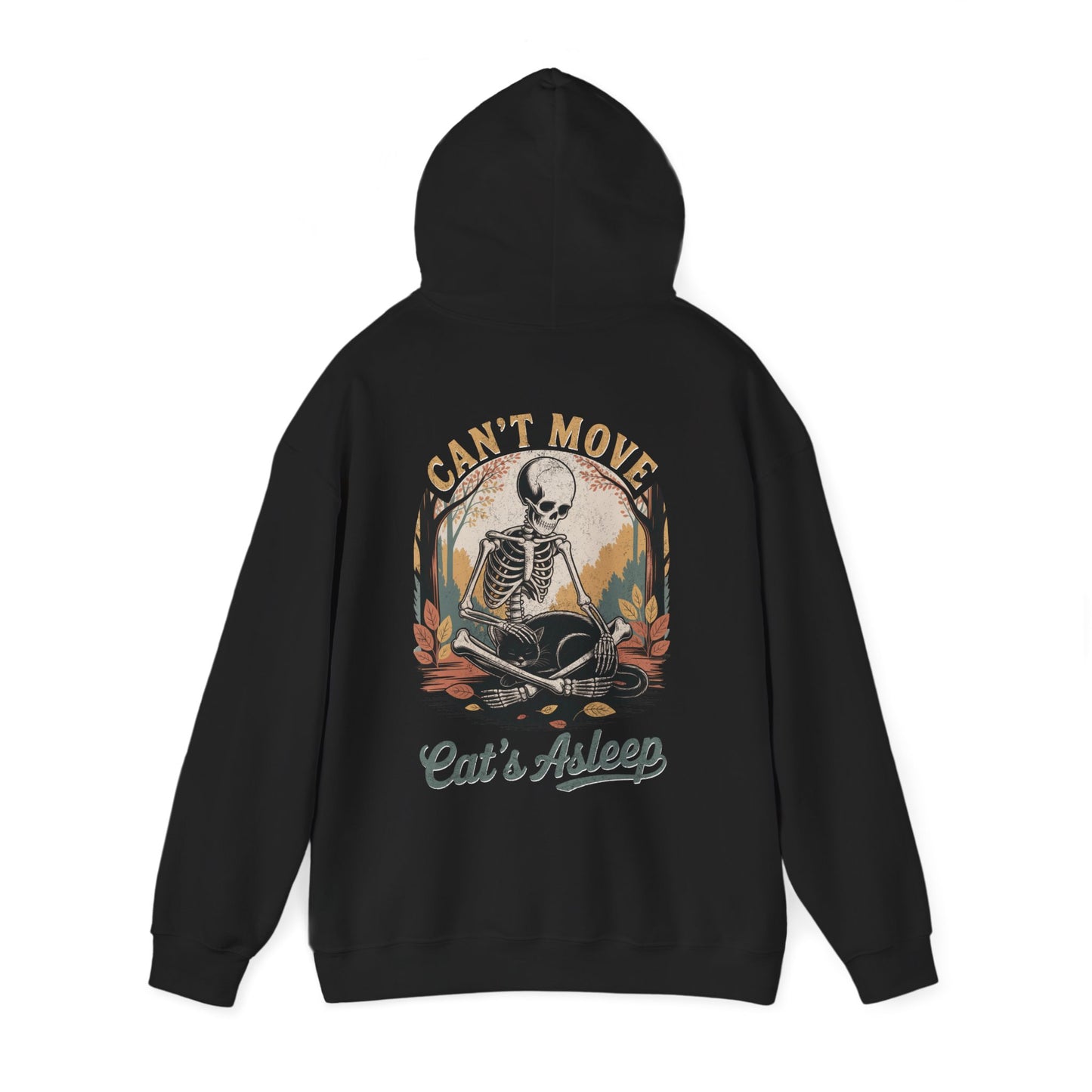 Relaxed skeleton cradling black cat with eyes closed – cozy gothic fall hoodie by SkeletonWear Apparel