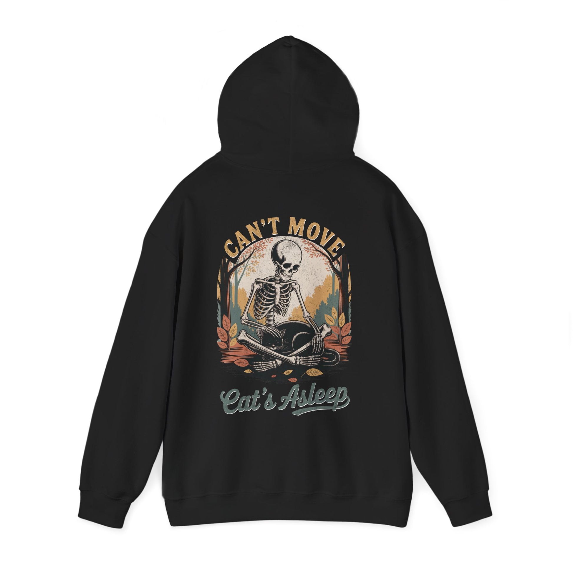 Relaxed skeleton cradling black cat with eyes closed – cozy gothic fall hoodie by SkeletonWear Apparel