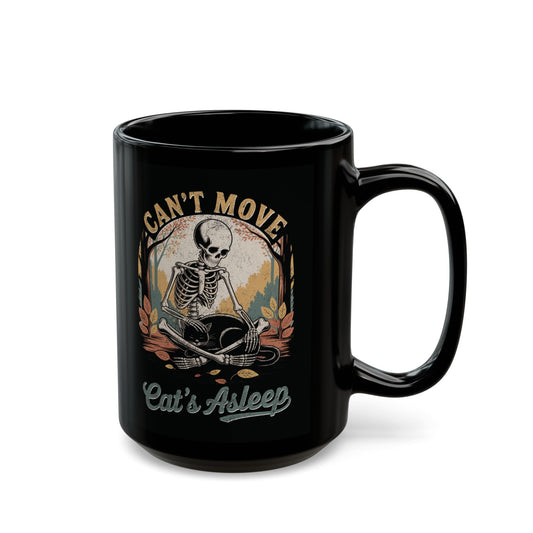 Relaxed skeleton cradling black cat with eyes closed – gothic fall coffee mug by SkeletonWear Apparel