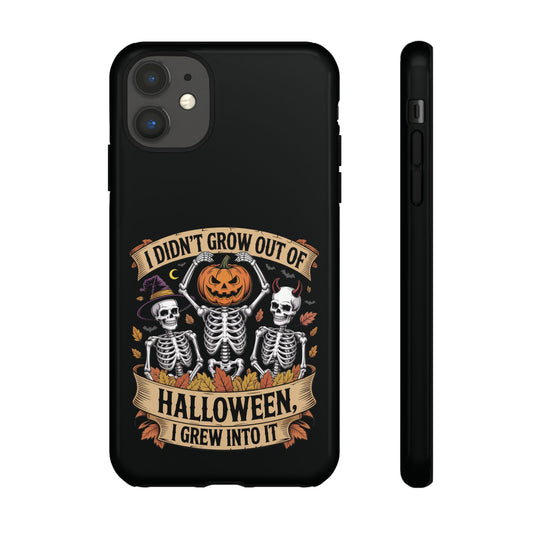 Black phone case with Halloween design featuring skeletons and a pumpkin.