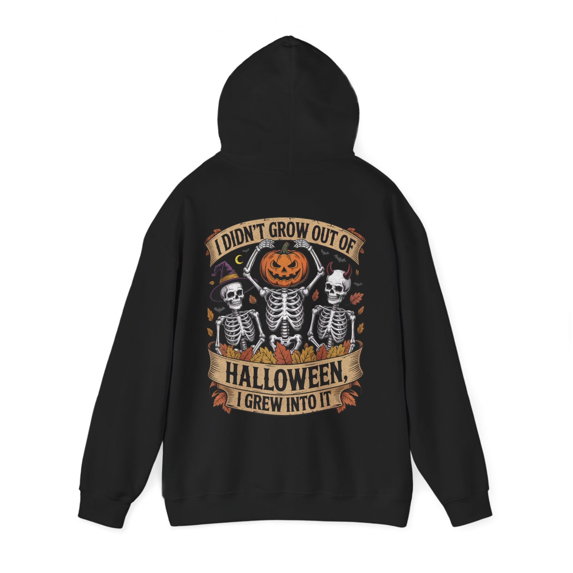 Skeletons with pumpkin, witch hat, and devil horns under banner ‘I Didn’t Grow Out of Halloween, I Grew Into It’ – SkeletonWear Apparel Halloween hoodie design