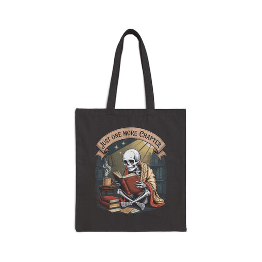 Gothic skeleton tote bag – skull in orange shawl reading antique book in vintage library with steaming mug, banner reads “Just ONE MORE Chapter”
