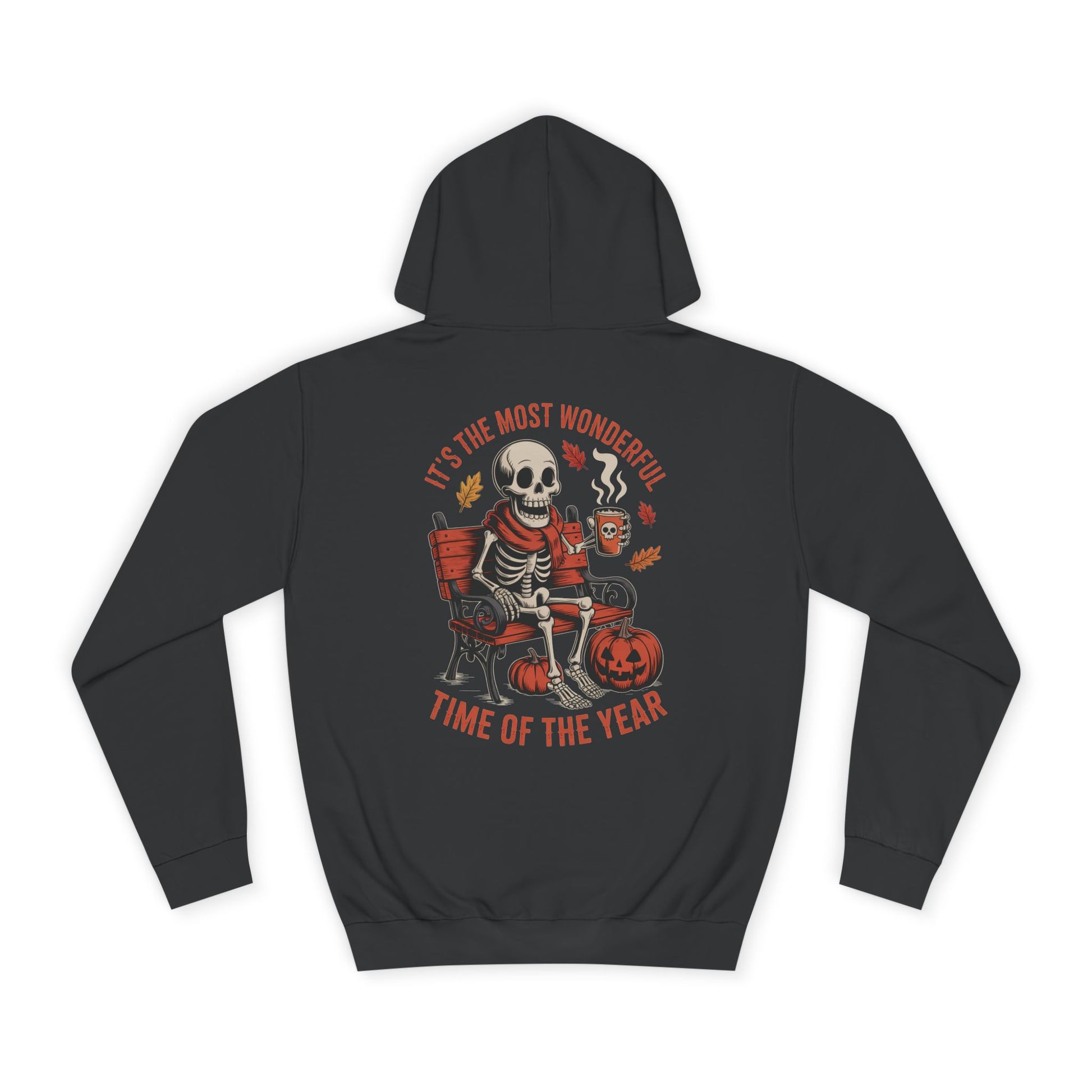 Skeleton wearing scarf drinking pumpkin spice latte on gothic bench with pumpkins and autumn leaves – cozy Halloween hoodie design by SkeletonWear Apparel