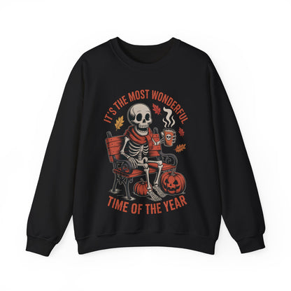 Skeleton in scarf sipping pumpkin spice latte on gothic bench with pumpkins and autumn leaves – cozy Halloween sweatshirt by SkeletonWear Apparel