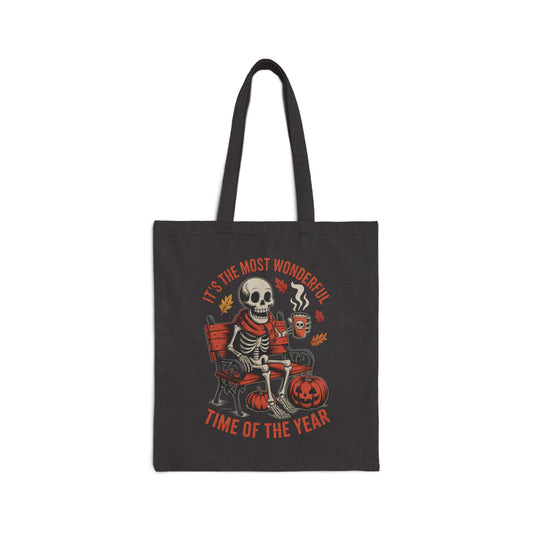 Skeleton in scarf drinking pumpkin spice latte on gothic bench with pumpkins and autumn leaves – spooky Halloween tote bag by SkeletonWear Apparel